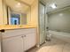 Well-lit bathroom featuring a vanity with a large mirror and a combined bathtub and shower at 5268 Middle Ct # 111, Orlando, FL 32811