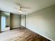 The bedroom offers wood flooring and mirrored closet doors to maximize space at 5268 Middle Ct # 111, Orlando, FL 32811