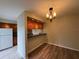 Open concept dining room with wood floors and chandelier at 5268 Middle Ct # 111, Orlando, FL 32811
