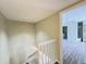 This home offers a hallway leading to a bedroom with wood flooring and mirrored closet doors at 5268 Middle Ct # 111, Orlando, FL 32811