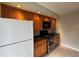 A modern kitchen with stainless steel appliances and wood cabinets at 5268 Middle Ct # 111, Orlando, FL 32811
