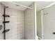 This home features a shower with convenient shelving and a showerhead at 5268 Middle Ct # 111, Orlando, FL 32811