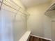 Walk-in closet provides ample storage space with wire shelving and a built-in bench at 5268 Middle Ct # 111, Orlando, FL 32811
