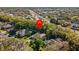 Aerial view with location pin over home showing lush tree coverage at 5325 Cypress Reserve Pl, Winter Park, FL 32792