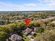 Aerial view of home and neighborhood, with location pin highlighting lake nearby at 5325 Cypress Reserve Pl, Winter Park, FL 32792