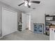 Spacious bedroom with a ceiling fan, ample closet space, and plush carpeting at 5325 Cypress Reserve Pl, Winter Park, FL 32792