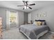 Inviting bedroom with a comfy bed, dresser, and a large window for plenty of natural light at 5325 Cypress Reserve Pl, Winter Park, FL 32792