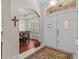 Elegant foyer with hardwood floors, a decorative rug, and views of the dining room at 5325 Cypress Reserve Pl, Winter Park, FL 32792