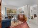 Inviting living room with hardwood floors, comfortable seating, and access to the outdoor patio at 5325 Cypress Reserve Pl, Winter Park, FL 32792