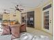 Covered patio with ceiling fan, recessed lights, wicker seating, and a sliding glass door at 5325 Cypress Reserve Pl, Winter Park, FL 32792