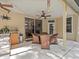 Covered patio features ceiling fan, recessed lights, wicker seating, and an outdoor kitchen at 5325 Cypress Reserve Pl, Winter Park, FL 32792