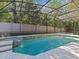 Sparkling pool and spa area surrounded by mature landscaping and a screened enclosure, great for outdoor enjoyment at 5325 Cypress Reserve Pl, Winter Park, FL 32792