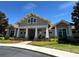 Charming community clubhouse featuring well-kept gardens and an inviting entrance at 5771 Mangrove Cove Ave, Winter Garden, FL 34787