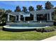 Orchard Hills community entrance featuring a water feature and lush landscaping at 5771 Mangrove Cove Ave, Winter Garden, FL 34787