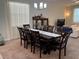 Elegant dining room features a modern chandelier and a dark wood table with seating for eight at 5771 Mangrove Cove Ave, Winter Garden, FL 34787