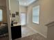 Welcoming entryway with tiled floor, a console table, and natural light coming through the windowed door at 5771 Mangrove Cove Ave, Winter Garden, FL 34787