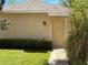 Exterior view of home with walkway and mature landscaping at 5771 Mangrove Cove Ave, Winter Garden, FL 34787