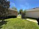 Home with well-kept lawn, mature landscaping and walkway at 5771 Mangrove Cove Ave, Winter Garden, FL 34787
