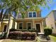 Lovely two-story home with a well-kept front yard and classic architectural details at 5771 Mangrove Cove Ave, Winter Garden, FL 34787