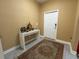 Charming foyer with a stylish console table, decorative accents, and a patterned rug at 5771 Mangrove Cove Ave, Winter Garden, FL 34787