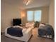 Bright living room featuring white sofas, a flatscreen TV, and cozy decor for relaxing and entertainment at 5771 Mangrove Cove Ave, Winter Garden, FL 34787
