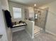 Bathroom vanity area with a built-in countertop and glass enclosed shower at 5771 Mangrove Cove Ave, Winter Garden, FL 34787