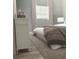 Cozy bedroom featuring a comfortable bed, soft carpet, and lots of natural light at 5830 Beechmont Blvd, Orlando, FL 32808