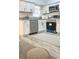 Updated kitchen features new appliances, white cabinets, granite countertops and modern fixtures at 5830 Beechmont Blvd, Orlando, FL 32808