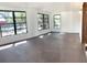 Spacious living room with large windows providing ample natural light at 5830 Beechmont Blvd, Orlando, FL 32808