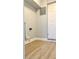 Well-lit room features wood-look flooring, and a white door at 5830 Beechmont Blvd, Orlando, FL 32808