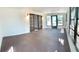 Bright sunroom with French doors and large windows, perfect for relaxing at 5830 Beechmont Blvd, Orlando, FL 32808