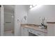Bright bathroom featuring a walk-in shower, granite countertop vanity, and modern fixtures at 610 Chestnut Oak Cir # 114, Altamonte Springs, FL 32701