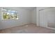 Bright bedroom with a large window overlooking lush greenery at 610 Chestnut Oak Cir # 114, Altamonte Springs, FL 32701