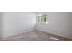 Empty bedroom featuring large window and plush carpeting at 610 Chestnut Oak Cir # 114, Altamonte Springs, FL 32701