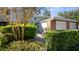 Charming home exterior featuring a brick accented garage and well-maintained landscaping at 610 Chestnut Oak Cir # 114, Altamonte Springs, FL 32701
