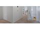 Bright hallway with plush carpeting and neutral tones that connects various rooms within the home at 610 Chestnut Oak Cir # 114, Altamonte Springs, FL 32701