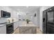 Bright kitchen featuring a large gray marble island and stainless steel appliances at 610 Chestnut Oak Cir # 114, Altamonte Springs, FL 32701