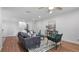 Bright living room with hardwood floors, neutral walls, and stylish contemporary furniture at 610 Chestnut Oak Cir # 114, Altamonte Springs, FL 32701