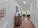 Open-concept living room with modern decor and recessed lighting, adjacent to carpeted stairs at 610 Chestnut Oak Cir # 114, Altamonte Springs, FL 32701