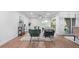 Bright living room featuring stylish furniture, natural light from sliding glass doors, and an adjacent dining area for entertaining at 610 Chestnut Oak Cir # 114, Altamonte Springs, FL 32701