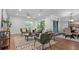 Bright living room featuring stylish furniture, natural light from sliding glass doors, and an adjacent dining area for entertaining at 610 Chestnut Oak Cir # 114, Altamonte Springs, FL 32701
