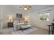 Bright main bedroom features a cozy seating area, complemented by natural light and tasteful decor at 610 Chestnut Oak Cir # 114, Altamonte Springs, FL 32701