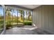 Screened-in patio featuring a tiled floor overlooking lush greenery at 610 Chestnut Oak Cir # 114, Altamonte Springs, FL 32701