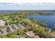 Picturesque aerial view of the golf course, lakes, and luxury homes in the community at 6120 Payne Stewart Dr, Windermere, FL 34786