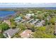 Beautiful aerial view of the community clubhouse, pool, golf course, and surrounding lake at 6120 Payne Stewart Dr, Windermere, FL 34786