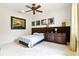 Cozy bedroom with ceiling fan, carpet, and modern decor at 6120 Payne Stewart Dr, Windermere, FL 34786