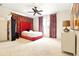 Spacious bedroom with unique curtains, modern ceiling fan and neutral carpet at 6120 Payne Stewart Dr, Windermere, FL 34786
