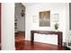 Inviting entryway featuring hardwood floors, a decorative table, and elegant wall decor at 6120 Payne Stewart Dr, Windermere, FL 34786