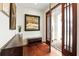 Welcoming entryway with hardwood floors, stylish decor, and a view of the front porch at 6120 Payne Stewart Dr, Windermere, FL 34786