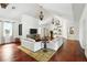 Spacious living room with vaulted ceilings, hardwood floors, and comfortable seating at 6120 Payne Stewart Dr, Windermere, FL 34786